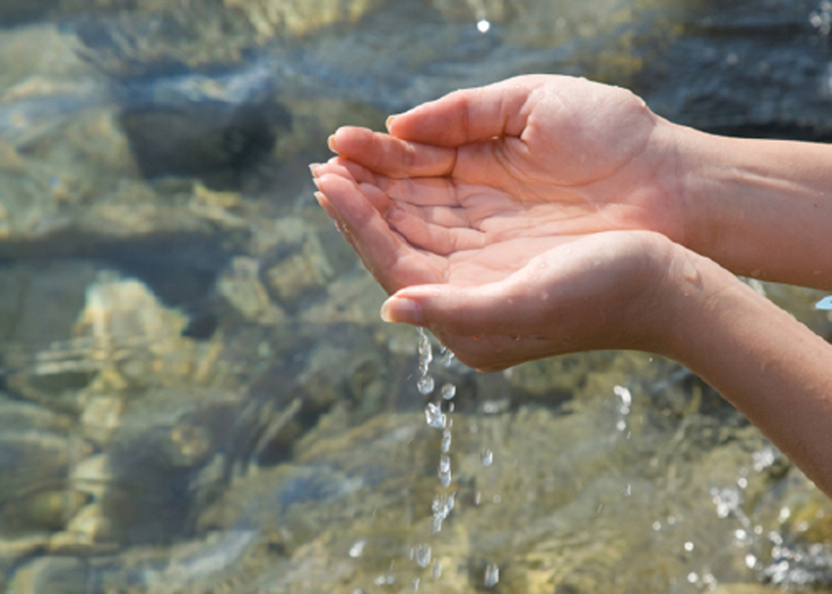 hands cupping water copy | Wellspring Passages